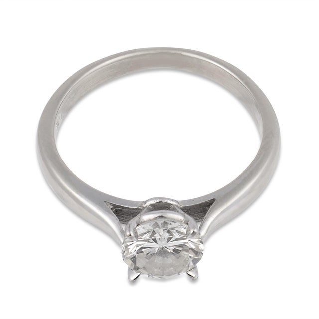 A timeless and elegant vintage engagement ring, this design centers on a brilliant 1.30 carat round cut diamond. Its...