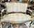 A French staple in any of the classes sitting rooms, this 1880-1890s French Louis XV style gilded settee with rococo...