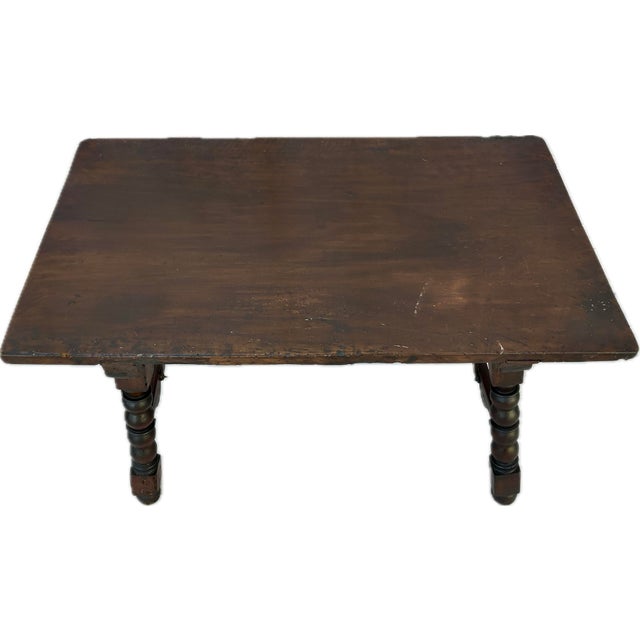 Spanish Baroque Trestle Table. Table is crafted from solid hardwood with a richly worn surface and features a thick...