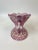 Intricately hand painted pink glazed porcelain bowl with two sphinx figures on each side. The intricate paintings depict...