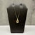 This teardrop necklace is crafted in 10kt yellow gold and features a graceful teardrop pendant with a polished finish. The...