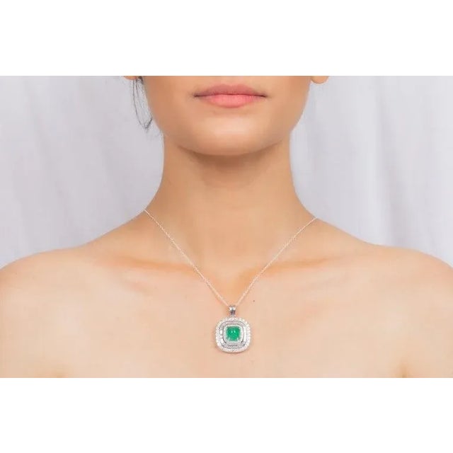 This is part of Chairish’s Fine Jewelry assortment. Regal Halo Diamond Emerald Pendant in 18K Gold studded in white gold...