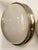The “Sigma” wall lamp in nickel-plated brass and pressed glass, designed by Sergio Mazza in the 1960s for Artemide. The...