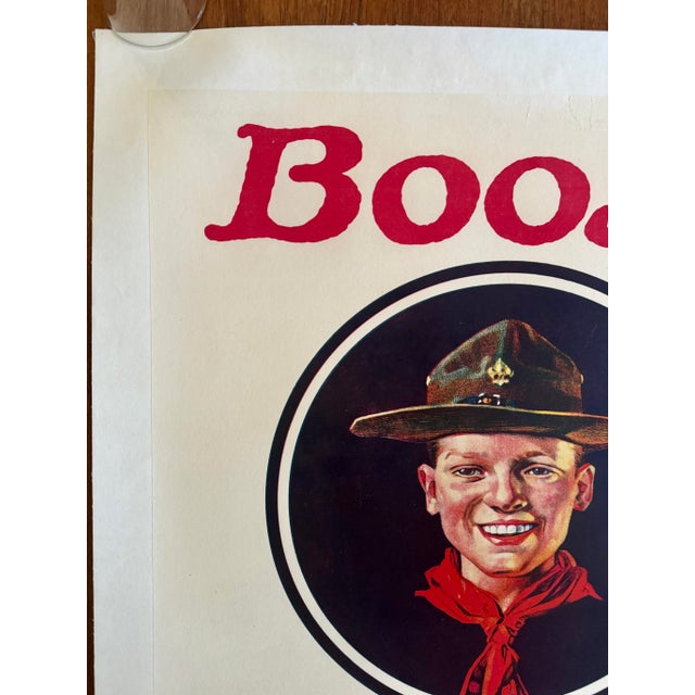 This iconic Boy Scout poster, featuring artwork by Norman Rockwell, is in its original state, linen backed for long-term...