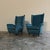 A pair of 1950s armchairs, high-quality Italian craftsmanship. The armchairs have a well-crafted wooden frame, a high...