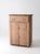 An antique painted wood cupboard featuring a timeworn faded peach finish, contrasting natural wood plank top, and...