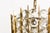 This chandelier has a brass construction that holds faceted diamond shaped crystals and was produced by Bakalowits &...