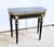 Console Napoleon III games table, in blackened wood, dating from half of the 19th century. Its portfolio top is cut and...