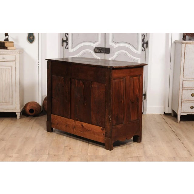 A French Louis XIV period walnut buffet from the 18th century with two drawers over two doors, carved X-Form and...