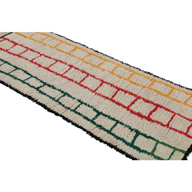 Hand-knotted in wool circa 1950-1960, this vintage 3x7 Moroccan runner is believed to hail from the Azilal tribe. On the...