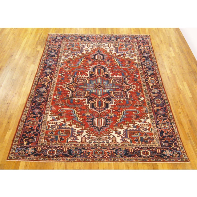 Vintage Persian Heriz Oriental rug, room size A vintage Persian Heriz oriental rug, size 10'0" x 7'2", circa 1930. This...