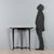 Elegant 20th-century Italian-made wall-mounted console table made of stained beech wood with a rounded top, a small...