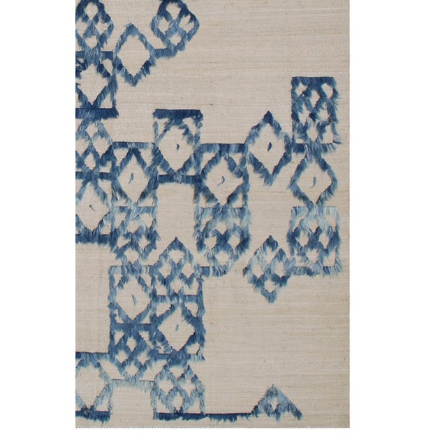 8'x10' Blue and White Ariana Modern Kilim Rug This 8'x10' Ariana Modern Kilim is a sophisticated fusion of contemporary...