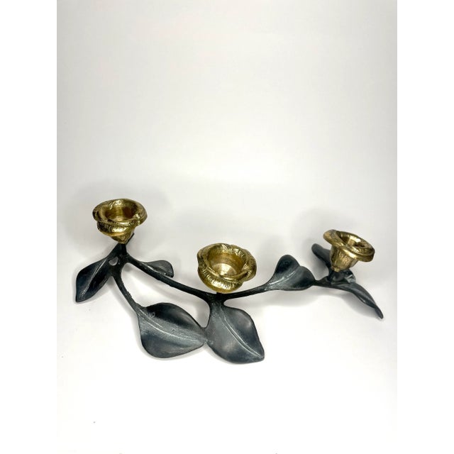 This free form, art nouveau heavy brass and pewter color carved candle holder holds three, (3), taper candles. It has a...