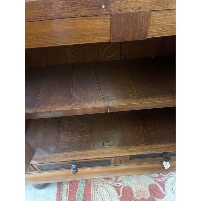 This stunning carved oak two-door cabinet showcases exceptional craftsmanship and timeless character. Constructed from...