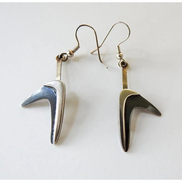 Vintage mid 20th century boomarang shape sterling silver earrings. Markings on back 925, Mexico JH makers mark. Contrast...