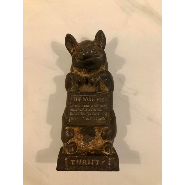 This fabulous 1950s Cast Iron “Thrifty — The Wise Pig” Doorstop / Bookend is joy only cute and functional, it will be a...