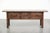This sturdy antique English-style sideboard from the 19th century has a beautiful country look and a stunning patina. It...