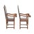 A pair of Spanish walnut armchairs covered in leather