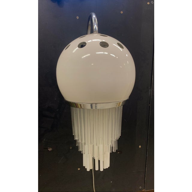 This is a pair of wall lamps attributed to the esperia company. typical 1970s lamps. the material is painted and chromed...