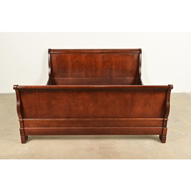 A gorgeous French Louis Philippe or Empire style carved cherry wood king size sleigh bed In the manner of Grange USA, Late...