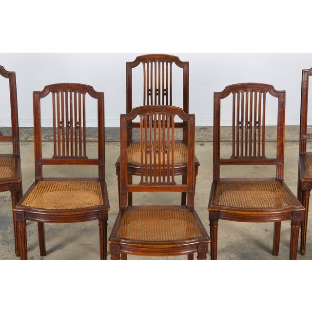 An exceptional set of six late 19th-century French dining chairs in the timeless Louis XVI style, sourced directly from...