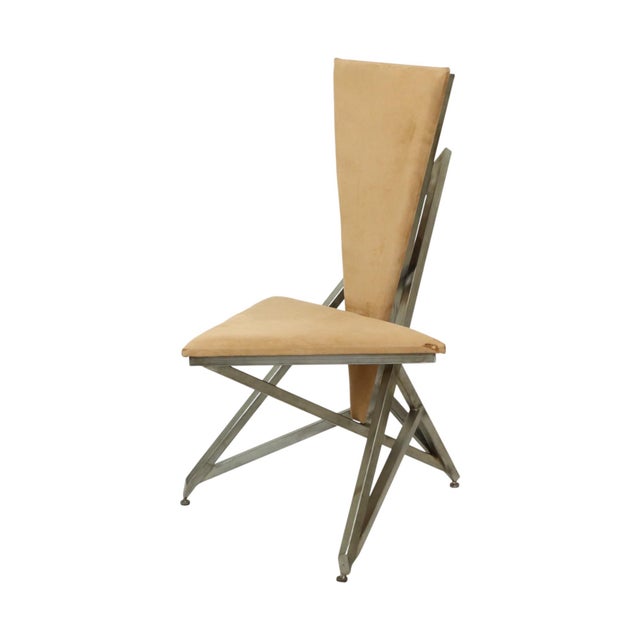 A beautiful and unique designer chair, entirely handmade from welded steel and triangular wooden panels upholstered in...