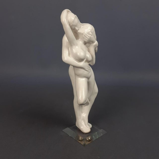 Wonderful vintage decorative sculpture, made of white ceramic on a glass base, depiction of a man and woman in love,...