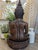 Beautiful vintage hand-carved wooden Buddha statue featuring intricate carved detailing and serene meditative pose. This...