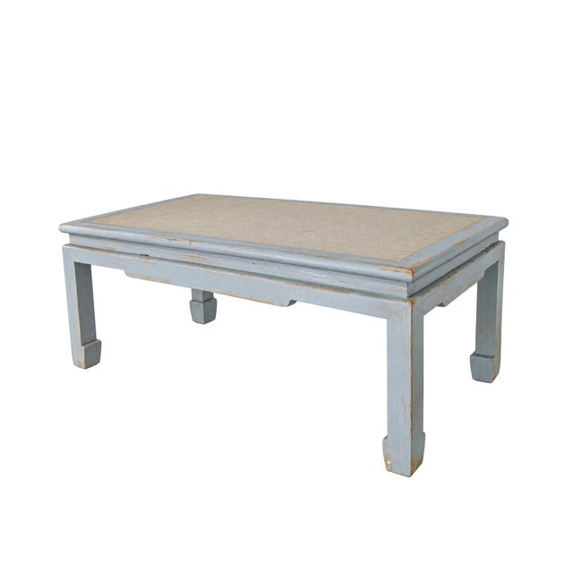 This sophisticated coffee table masterfully blends Eastern form with Scandinavian-inspired finishes, featuring a...