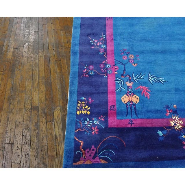 Floral Medallion Antique Hand Knotted Pile 1920s Wool Blue Rectangle Rug, Circa Date: 1920s. This exceptional example of...