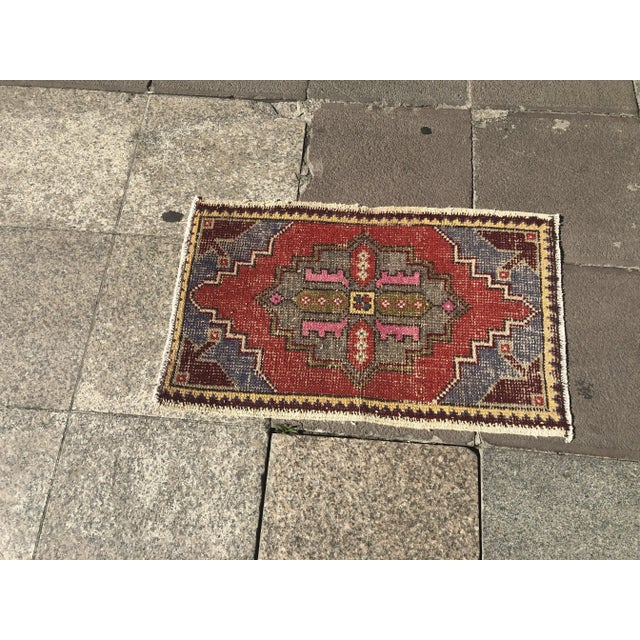 This is a vintage Turkish Oushak rug from the 1960s. The piece was hand-knotted.