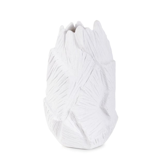 This unique vase showcases a stunning matte white finish that exudes modern sophistication. What truly sets it apart is...