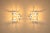 Italian lighting from the 1970s often balanced architectural clarity with decorative presence. These wall lamps by gaetano...