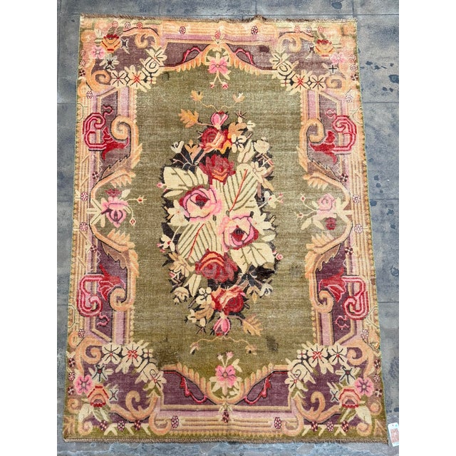 This antique Samarkand rug, dating to the early 20th century, is a distinctive example of the richly varied textile...