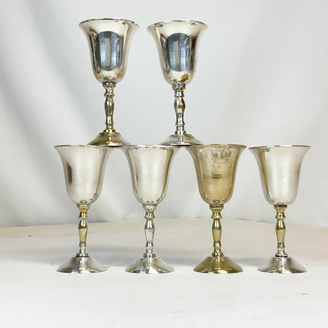 We have here a set of 6 Silver Plate Cordials from the Mid-Century. Five of the six are in very good condition. The sixth...