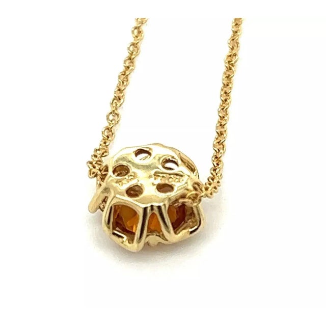 This is an elegant authentic pendant and chain from Tiffany & Co. It is crafted from 18k yellow gold featuring a lovely...