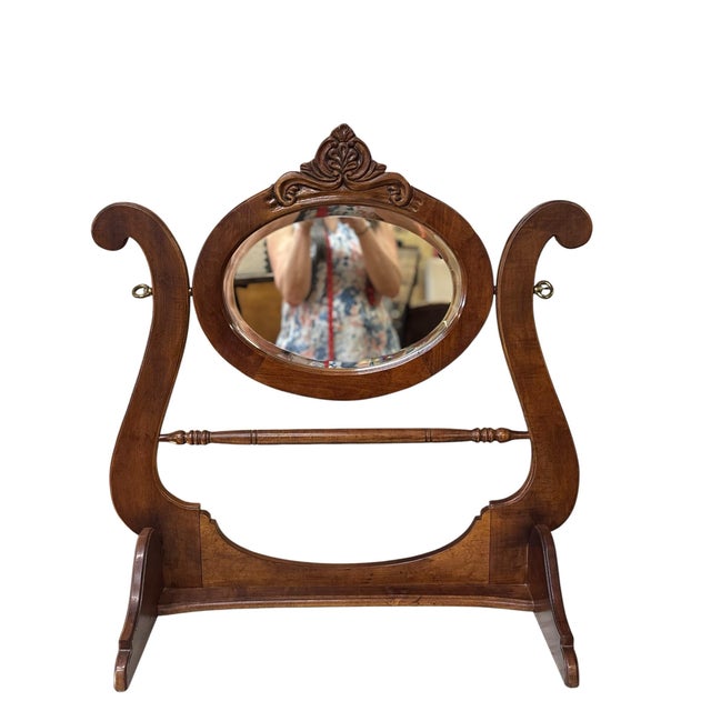An elegant late Victorian walnut washstand featuring richly carved details, a beautifully figured walnut finish, and its...