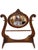 An elegant late Victorian walnut washstand featuring richly carved details, a beautifully figured walnut finish, and its...