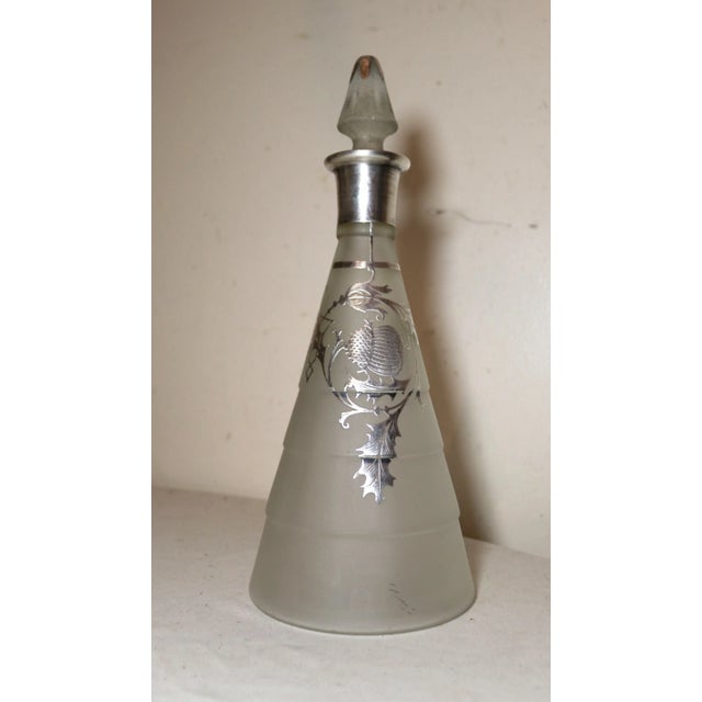 Up for sale is a very nice quality antique sterling silver over frosted glass decanter. The bottle is made of thick...