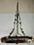 20th Century hand forged wrought iron pot rack with decorative vines and leaves throughout. It was hand made out of iron...