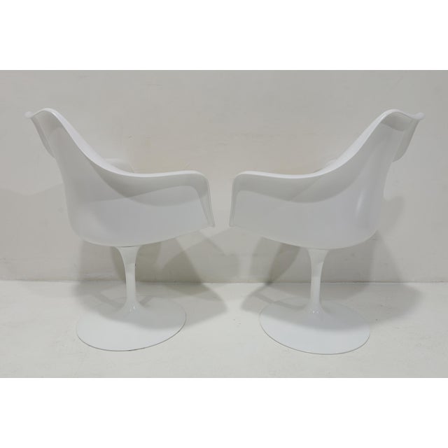 Great looking pair of armed tulip chairs by Eero Saarinen for Knoll. Practically brand new, very light use.