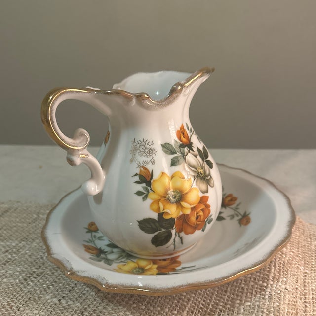 Enhance your space with this charming vintage floral water pitcher and basin set, a timeless accent that brings cottage...