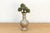 This vessel is a refined example of traditional ceramic work, featuring a classic double-gourd silhouette and a complex...