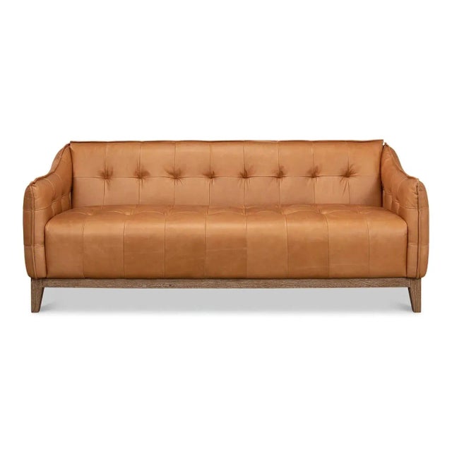 Modern style leather sofa with a distressed oak base. This contemporary sofa is upholstered in traditional brown leather...