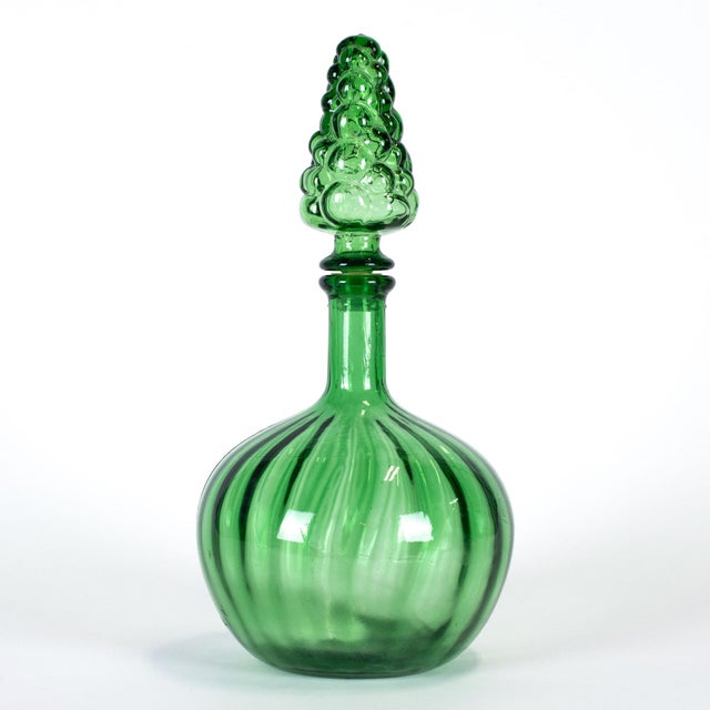 This Murano style art glass green decanter is of unknown make; probably Empoli. It is in good vintage condition. 6 3/4" L...