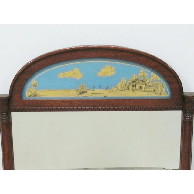 Mirror with reverse painted ocean scene with a house and clipper ship.