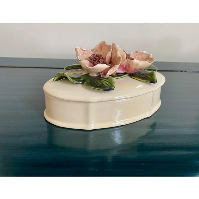 Beautiful double flower Magnolia & Leaves top, painted and glazed ceramic trinket box with detailed bottom. In A+...