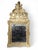 Elegant 18th-century French mirror with a carved wood frame, partially gilded, showcasing refined Rococo or Louis XV-style...