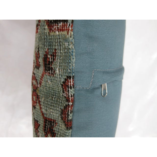 Pillow made from a antique tribal Caucasian rug with cotton back. Zipper closure and foam insert provided.